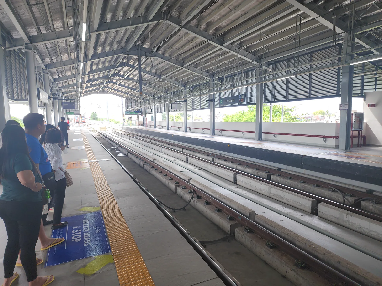 The Dr. Santos station of the LRT-1 Cavite Extension in Parañaque, seen from the platform under its long canopy.