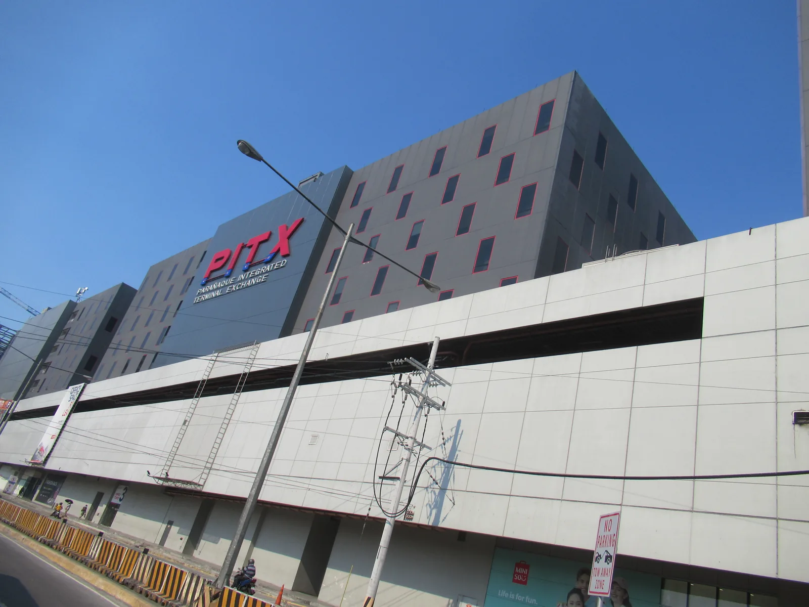 The Parañaque Integrated Terminal Exchange, a large bus terminal with bays and a wide concourse.